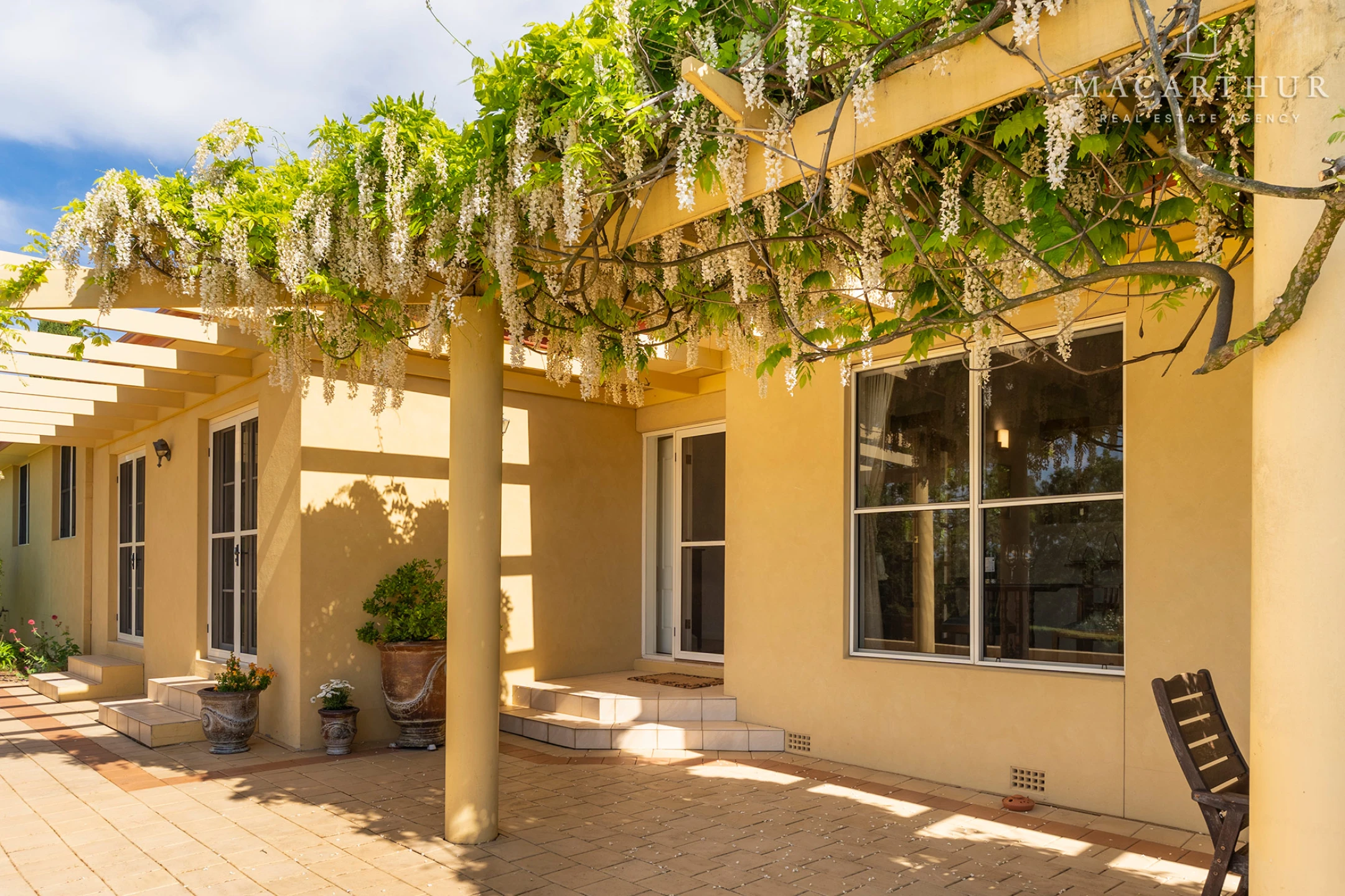 Grapevine-covered pergola at 2 Casuarina Place